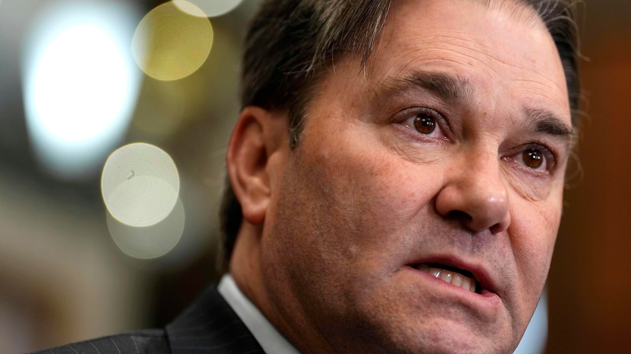 A man speaking into a microphone.