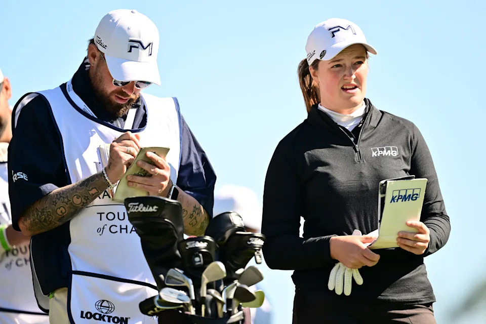 Lottie Woad of England and her caddie look on from the eighth tee during the first round of the Hilton Grand Vacations Tournament of Champions 2026 at Lake Nona Golf & Country Club on January 29, 2026 in Orlando, Florida.