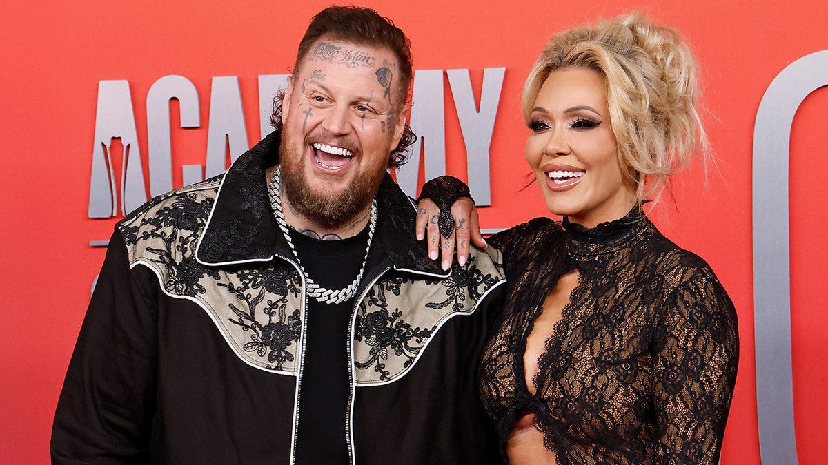 Jelly Roll and Bunnie XO pose on the red carpet