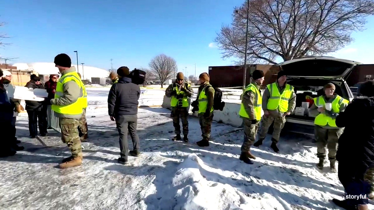 National Guard members handing out coffee and donuts