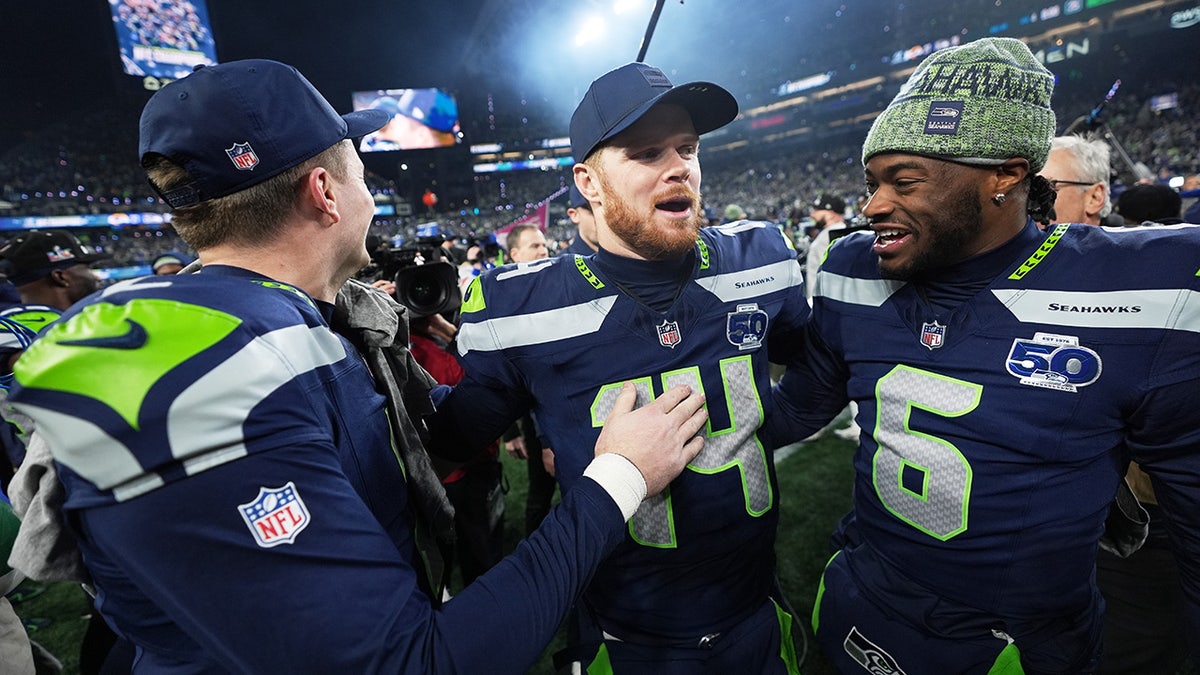 Sam Darnold walks off the field