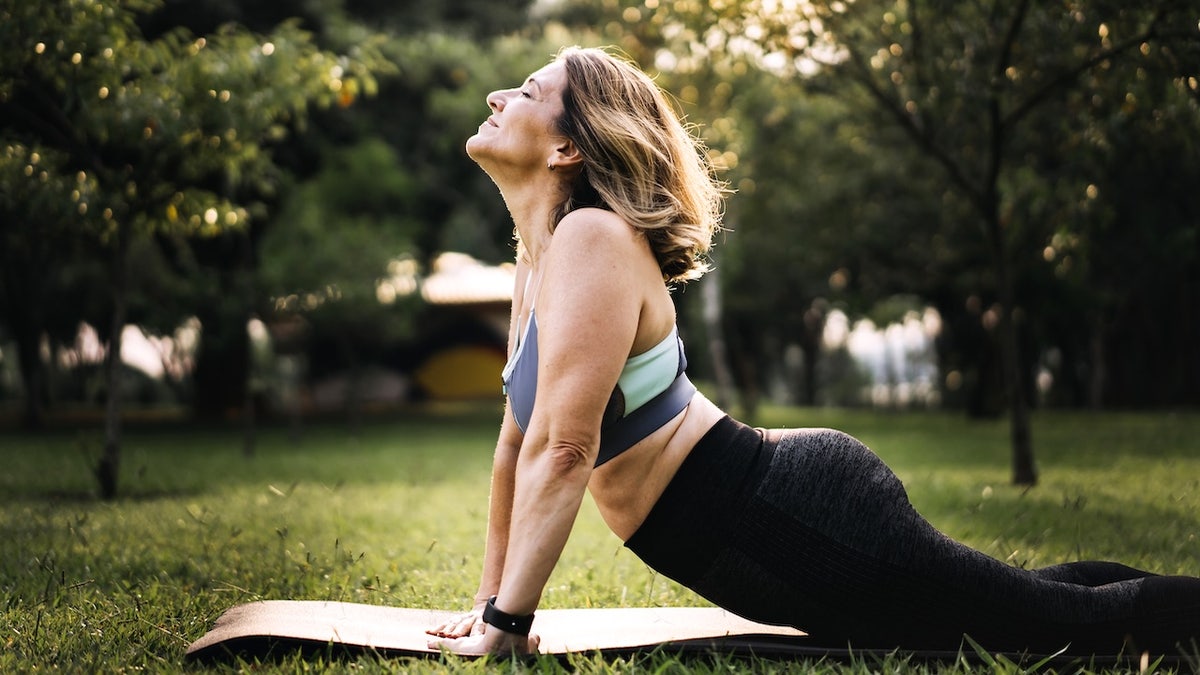 Woman doing yoga in the park