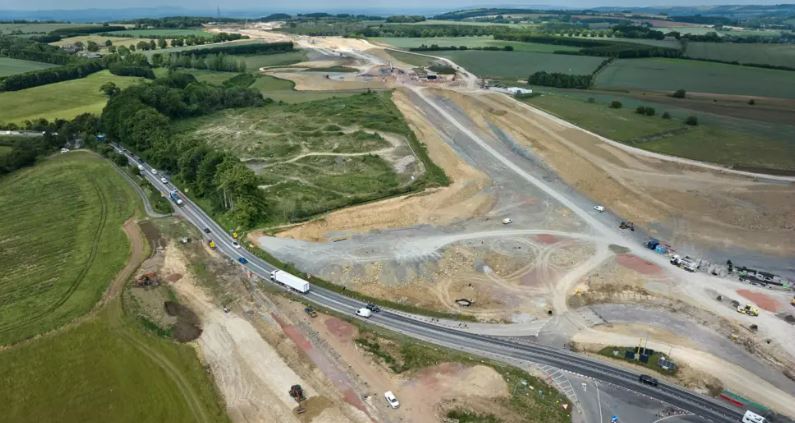 Man killed and woman & 2 children injured after crash with car transporter