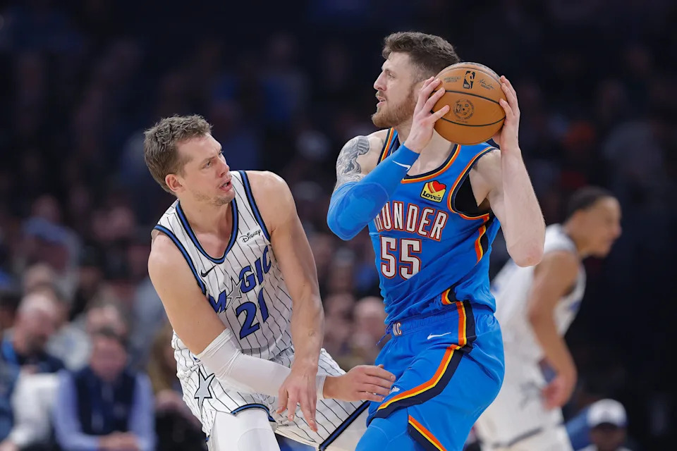 Feb 3, 2026; Oklahoma City, Oklahoma, USA; Oklahoma City Thunder center/forward Isaiah Hartenstein (55) moves the ball as Orlando Magic forward/center Moritz Wagner (21) defends during the second quarter at Paycom Center. Mandatory Credit: Alonzo Adams-Imagn Images