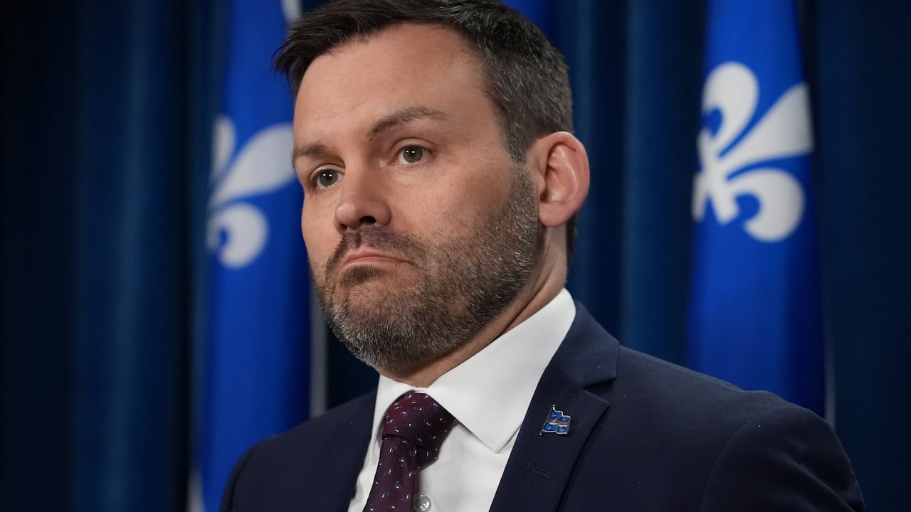A closeup of the face of PQ leader Paul St-Pierre Plamondon at a news conference