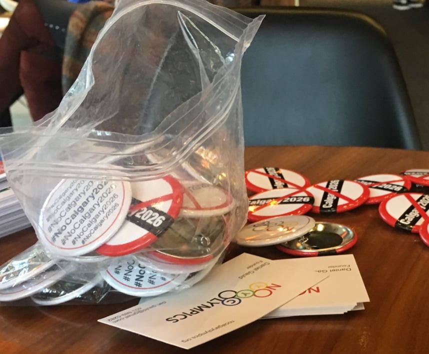The No Calgary Olympics campaign offered buttons and business cards to voters ahead of the city's plebiscite in 2018.