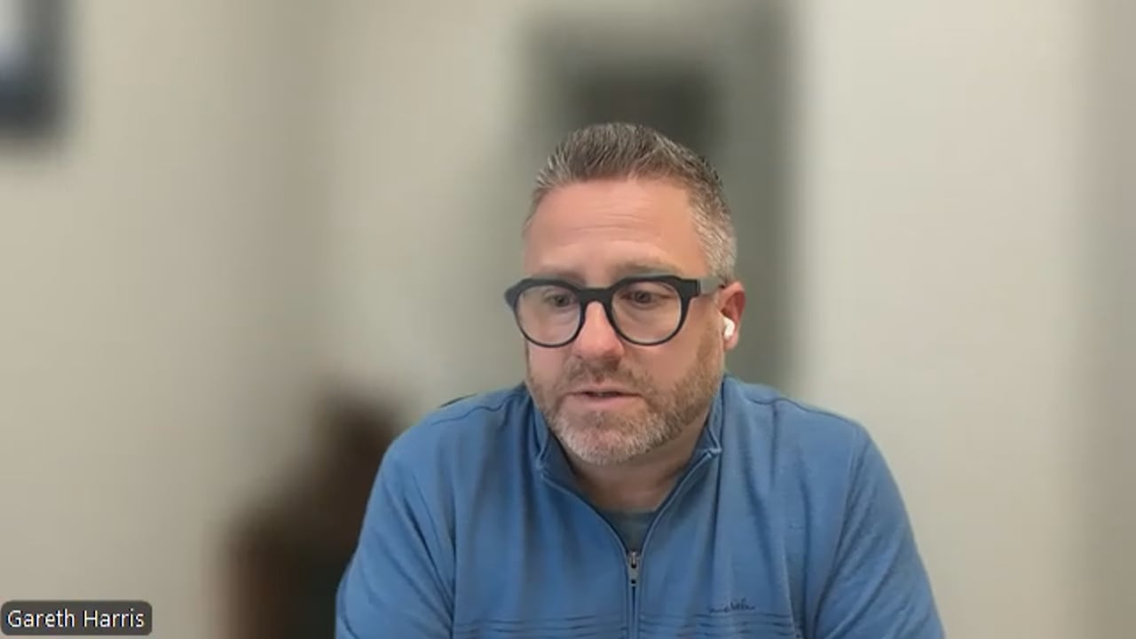 London Police Association President Gareth Harris conducts a Zoom interview wearing a blue sweater