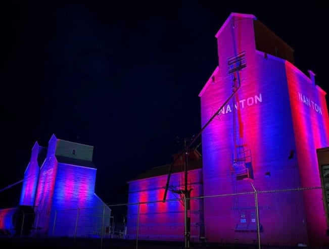 Buildings illuminated with the colours of the Southern Alberta Mustangs Junior Hockey Club