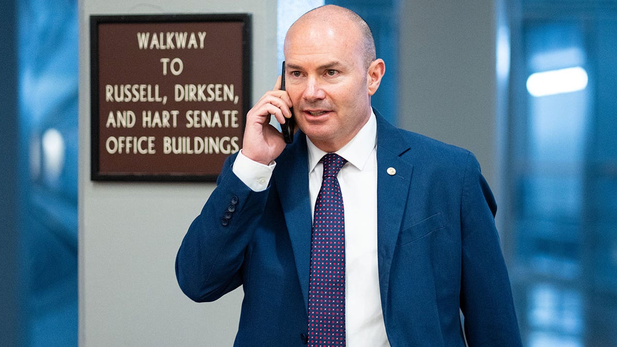 Sen. Mike Lee, R-Utah, walks through the Senate subway.