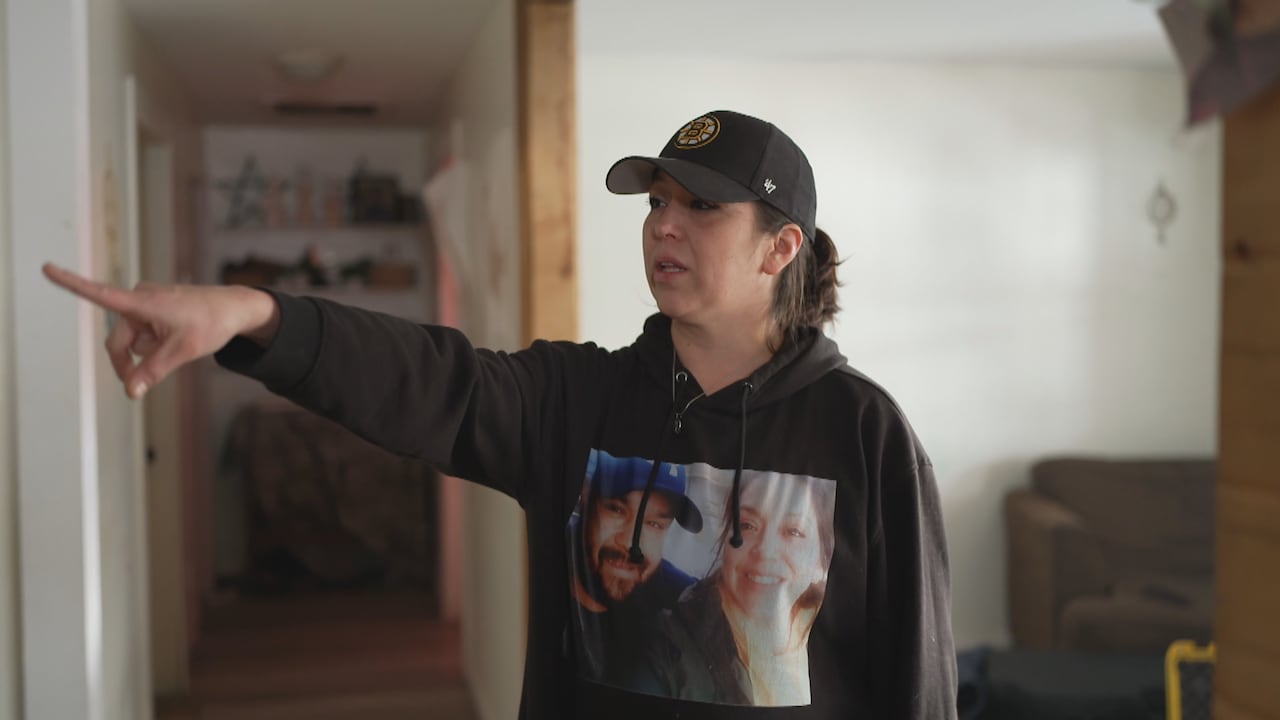 Woman pointing at wall