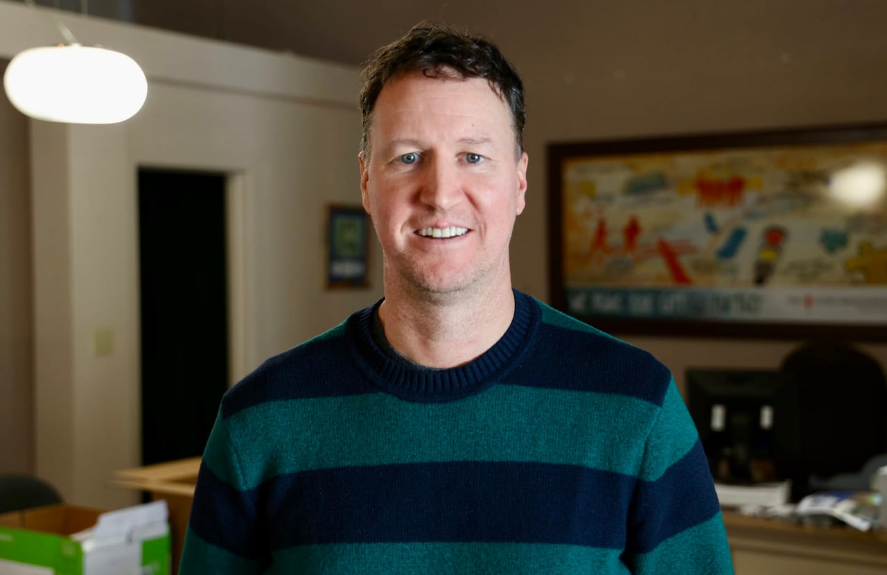 A man stands in an office.