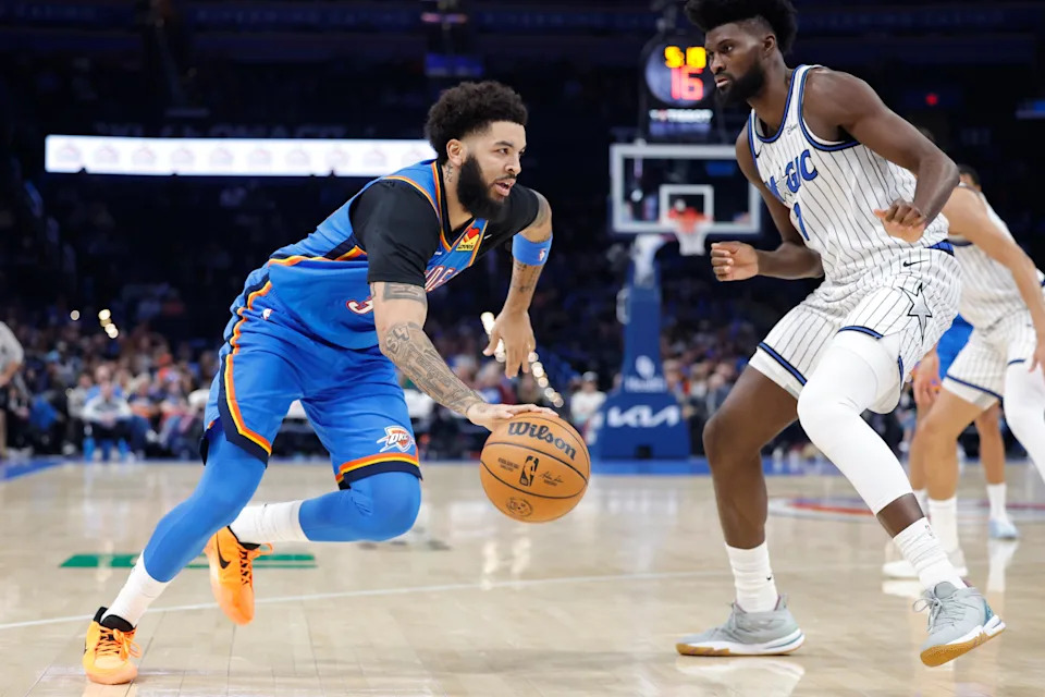 Feb 3, 2026; Oklahoma City, Oklahoma, USA; Oklahoma City Thunder guard/forward Kenrich Williams (34) drives to the basket against Orlando Magic forward Jonathan Isaac (1) during the second half at Paycom Center. Mandatory Credit: Alonzo Adams-Imagn Images