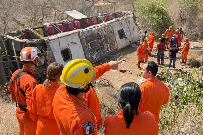 This handout photo provided by the Alagoas State government shows rescue officers working at the site of a deadly bus accident on state highway AL-220 in the city of Sao Jose da Tapera, Alagoas state, Brazil, on February 3, 2026.A bus accident in northeastern Brazil killed at least 15 people on February 3, including three children, state officials said in a statement. The bus had been carrying about 60 people taking part in a pilgrimage when it overturned in the rural interior of Alagoas state.