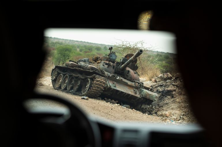 FILE - A destroyed tank is seen by the side of the road south of Humera, in an area of western Tigray, annexed by the Amhara region during the ongoing conflict, in Ethiopia, May 1, 2021. (AP Photo/Ben Curtis, File)