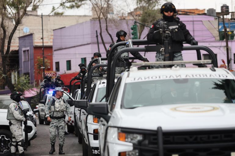 National Guard members patrol the area outside the General Prosecutor's headquarters in Mexico City