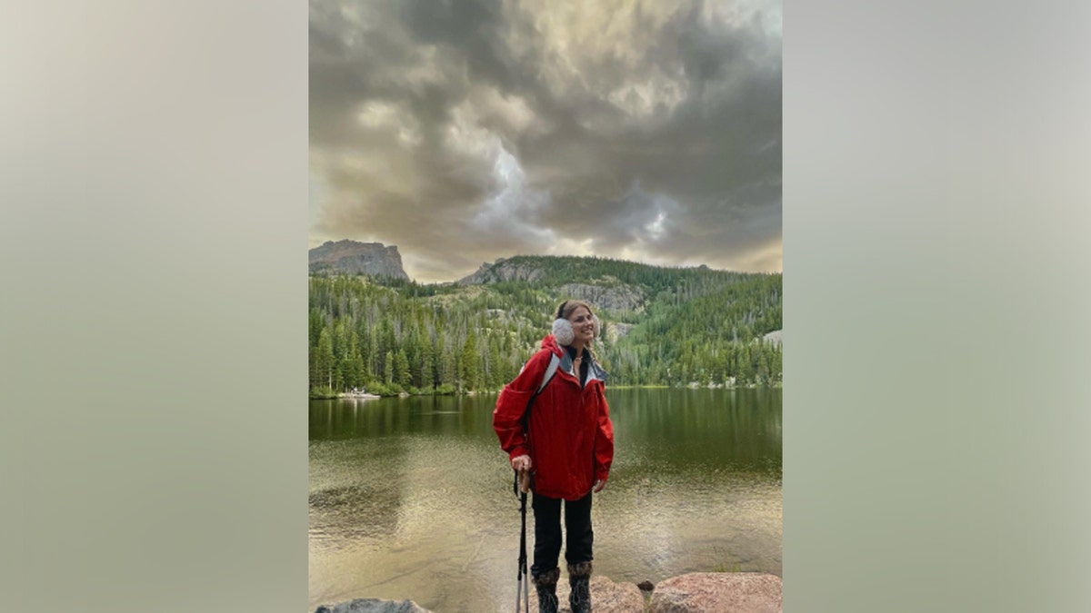 Brianna Mohr standing front of a scenic background