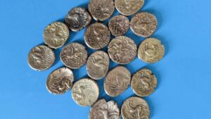 Iron Age gold coins dug up by metal detectorist in UK field tipped to fetch £25k