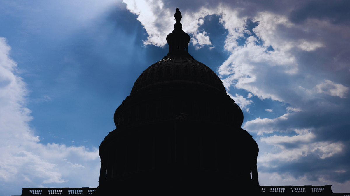The sun behind the U.S. Capitol in Washington.