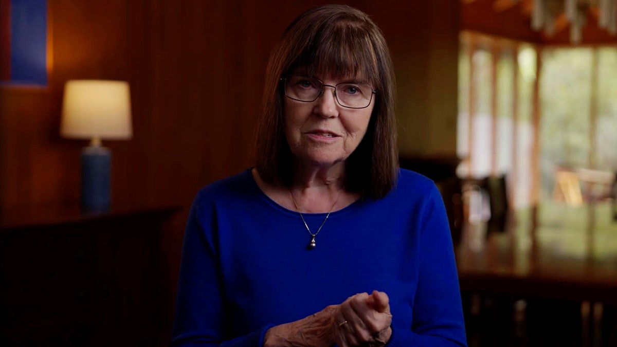 Edna Martin wearing a blue dress.