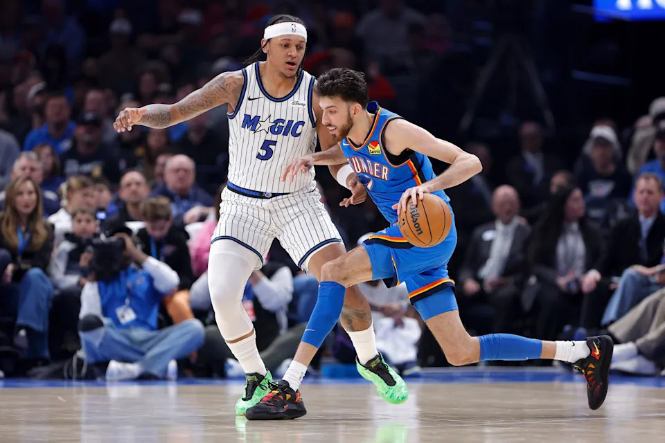 Feb 3, 2026; Oklahoma City, Oklahoma, USA; Oklahoma City Thunder center/forward Chet Holmgren (7) drives past Orlando Magic forward Paolo Banchero (5) during the second quarter at Paycom Center. Mandatory Credit: Alonzo Adams-Imagn Images