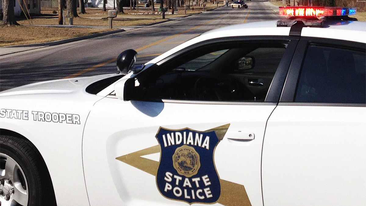 Indiana State Police vehicle with lights on