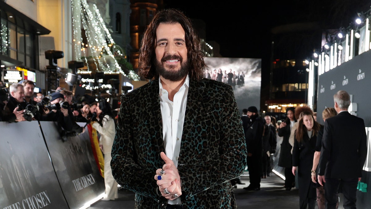 Jonathan Roumie wearing a cheetah print black blazer at the season 4 premiere of "The Chosen."