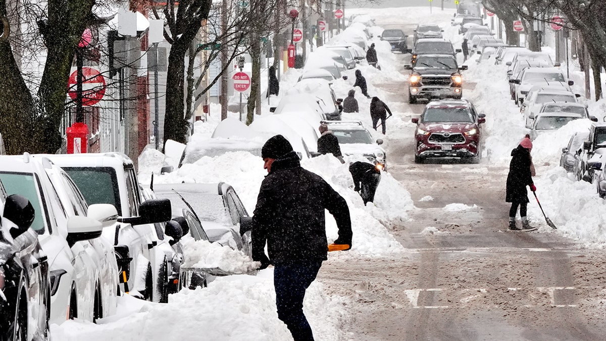 Residents dig out their cars in Boston