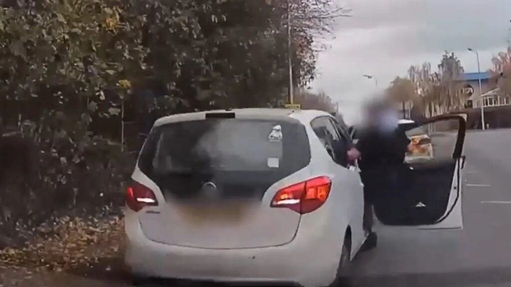 Moment cop desperately clings to side of car as drug dealer drags him down road