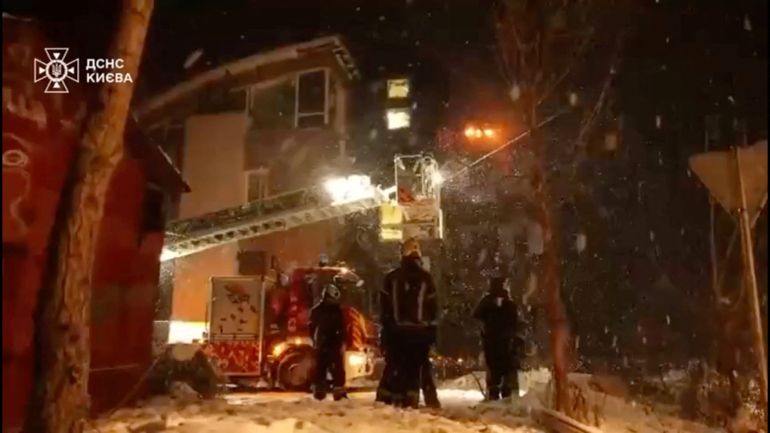 Firefighters work near a building damaged in a Russian overnight drone attack, amid Russia's attack on Ukraine, in a place given as Kyiv, Ukraine February 5, 2026, in this screengrab from a handout video. State Emergency Service Of Ukraine In Kyiv Region/Handout via REUTERS THIS IMAGE HAS BEEN SUPPLIED BY A THIRD PARTY. MANDATORY CREDIT. DO NOT OBSCURE LOGO.