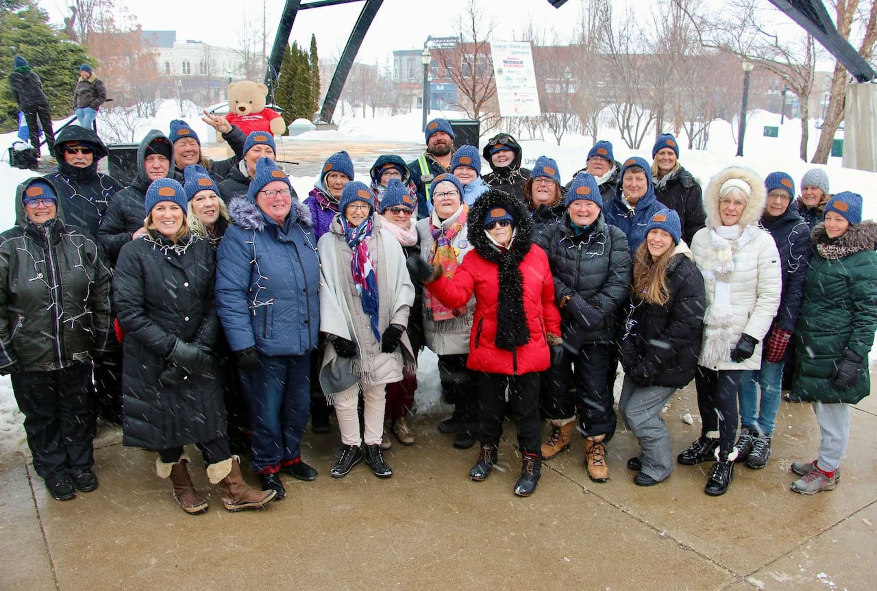 group wears matching hats