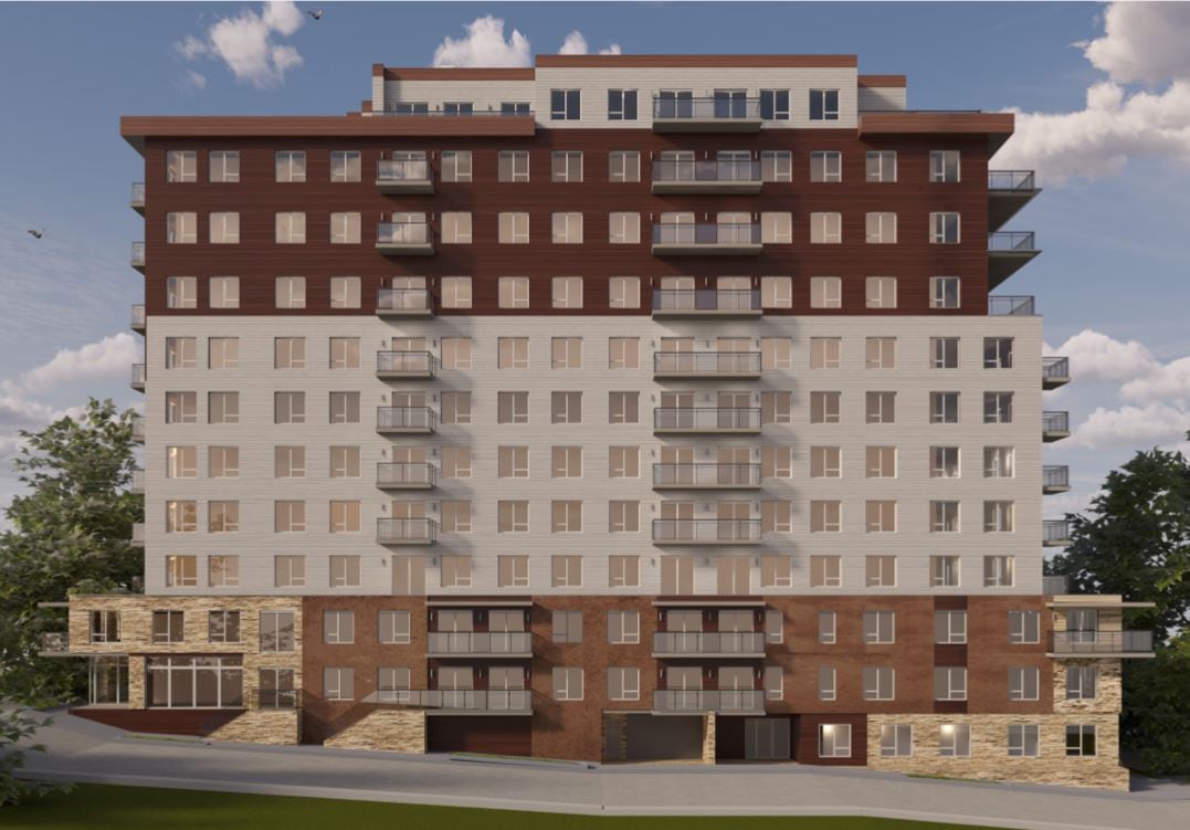 A computer image shows a tall building with a penthouse and balconies