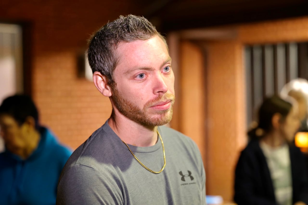 A man with blue eyes stares.