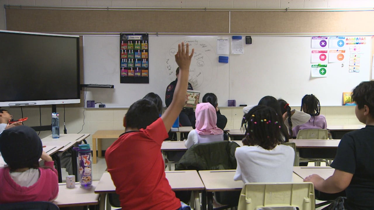 Children sitting in a classroom.