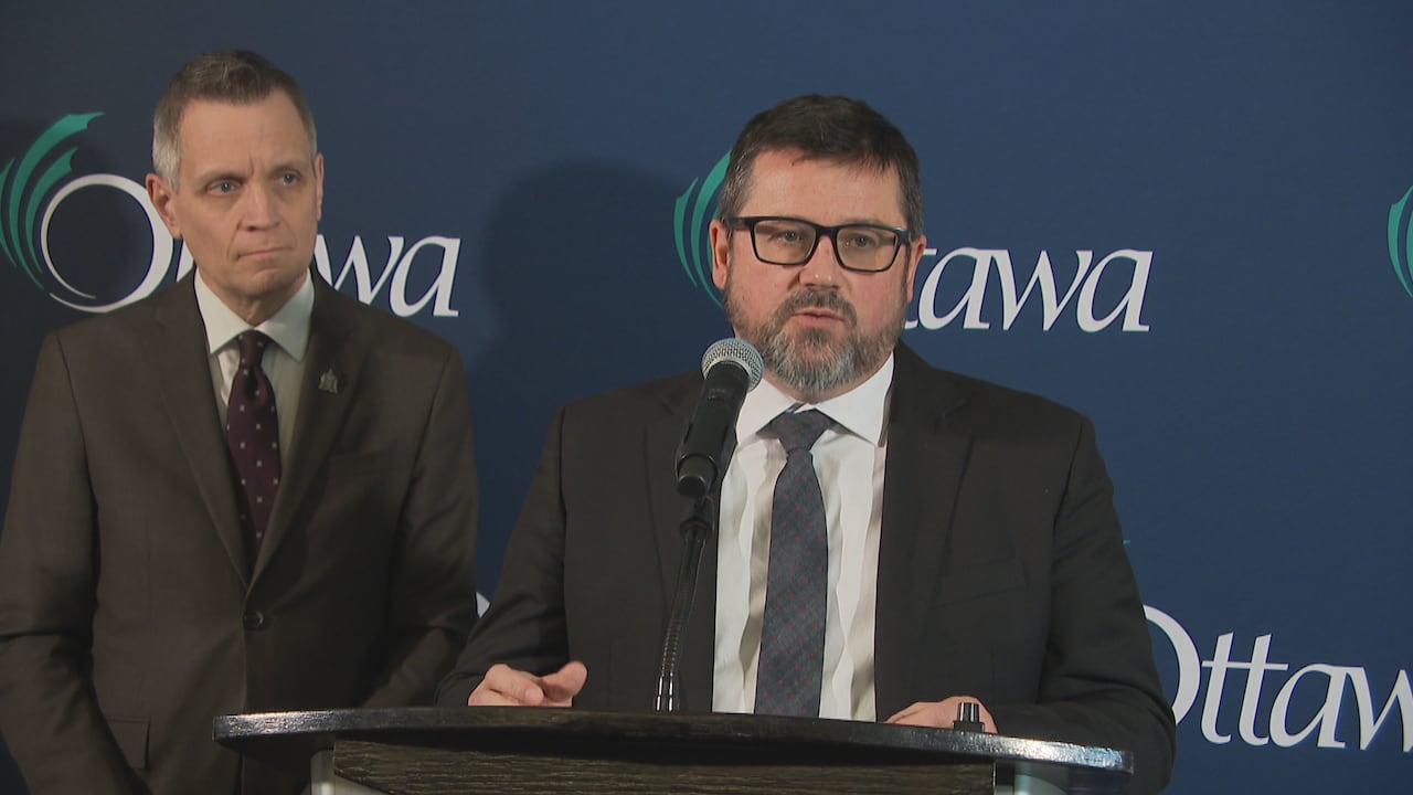 A man speaking at a podium