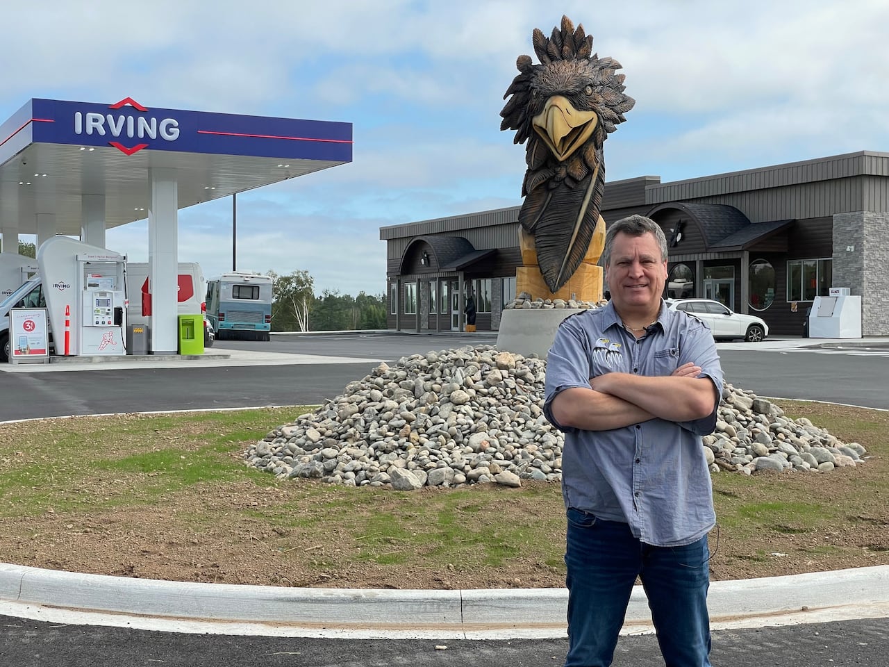 Terry Richardson in front of gas bar and eagle carving