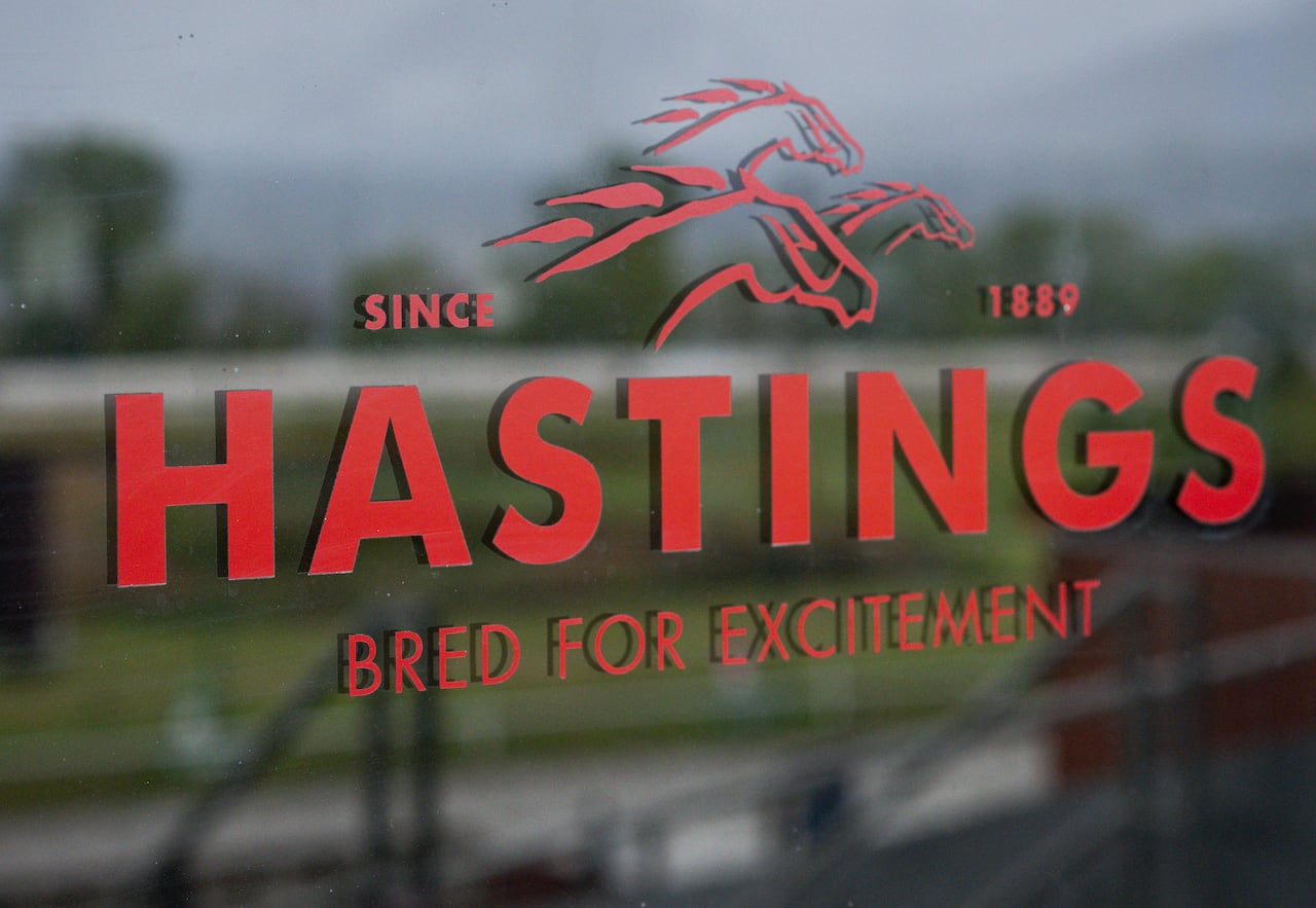 A sign with horses reads 'Hastings bred for excitement'.