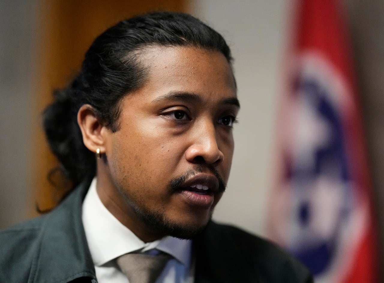 A man in a suit and tie facing slightly off-camera.