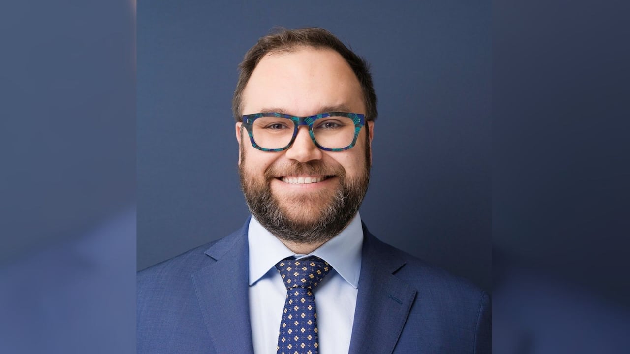 A man's headshot is pictured.