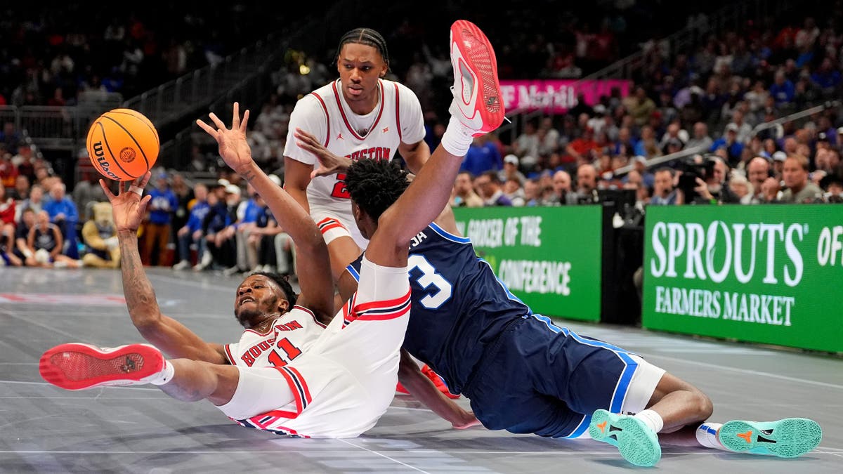 Joseph Tugler passes as BYU's AJ Dybantsa (3) defends