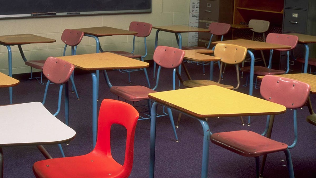 A photo of student desks inside a classroom.