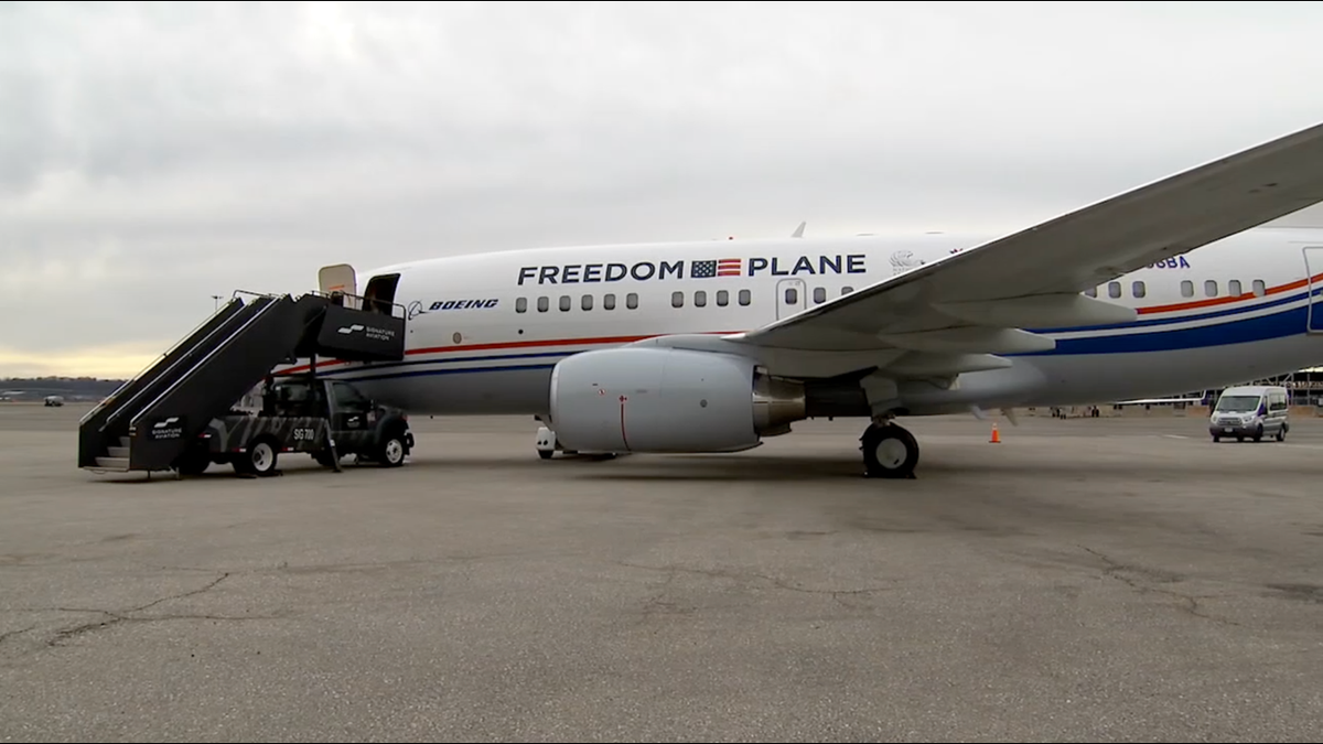 Boeing aircraft labeled Freedom Plane on the tarmac carrying historic U.S. founding documents for the National Archives national tour.