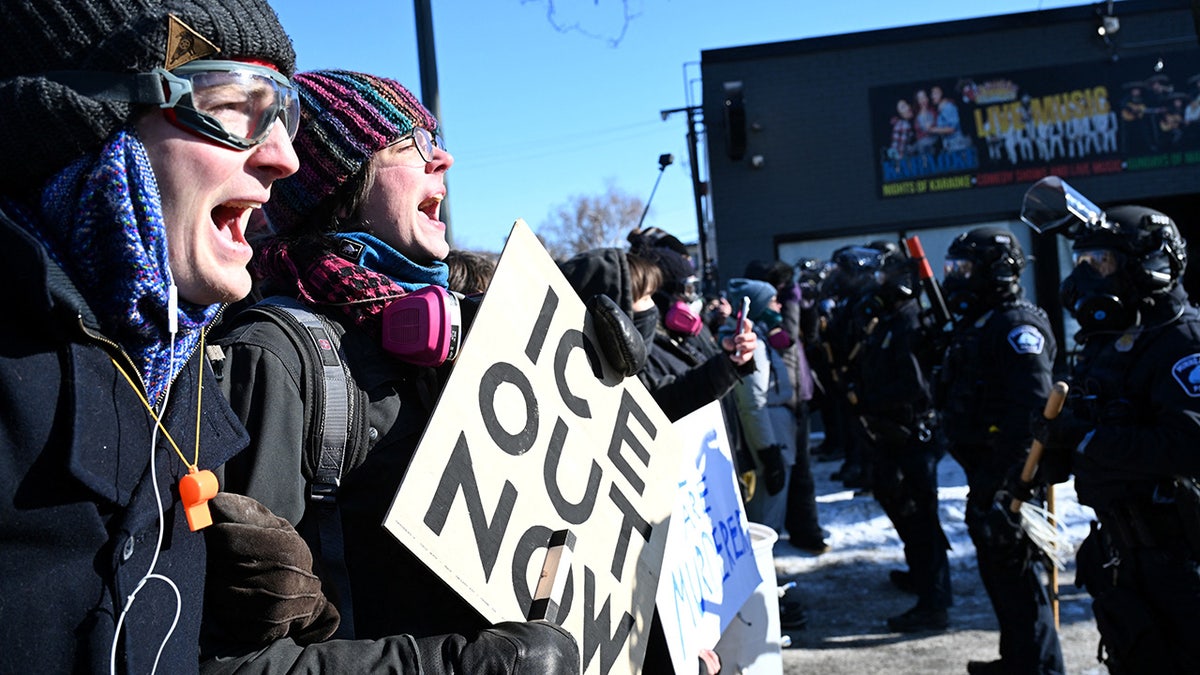 Protesters face off with Minneapolis police officers in Minneapolis, Minn.