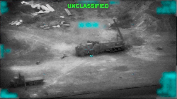 "Unclassified" aerial footage shows a missile launcher being struck by an explosive.