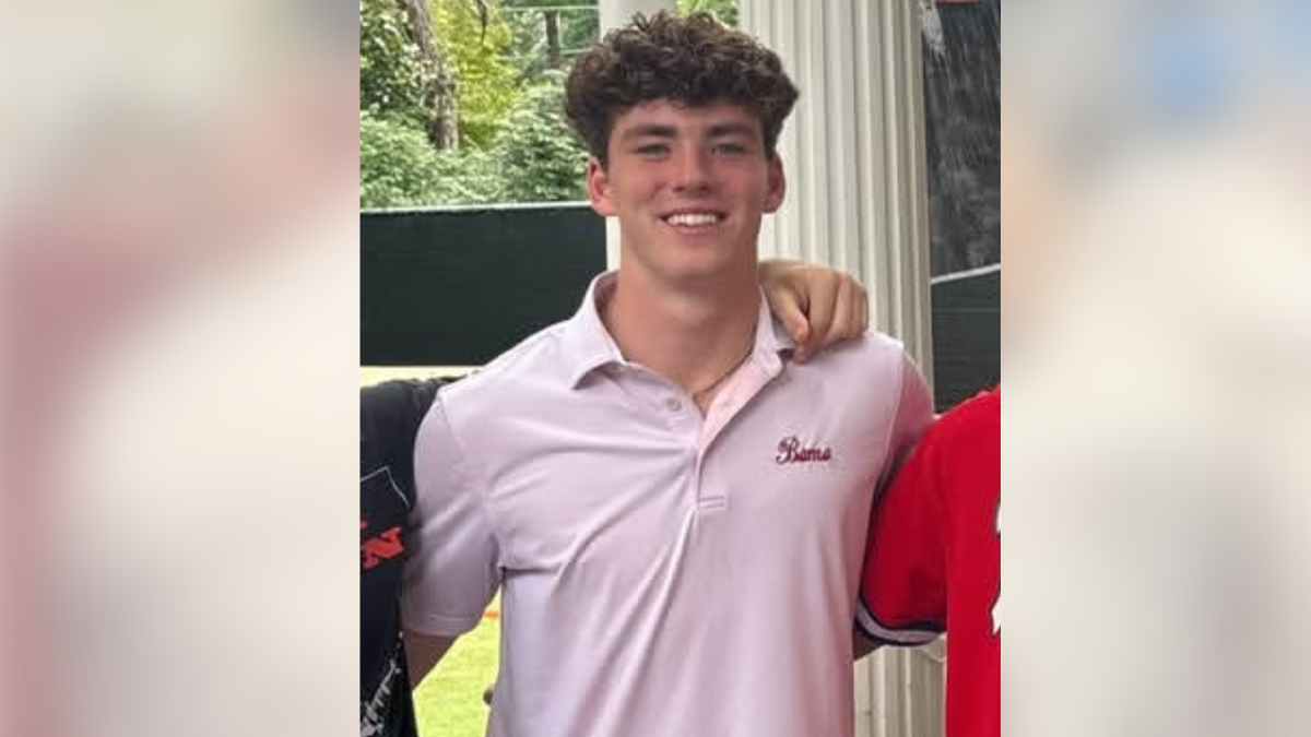 Jimmy Gracey wearing a pink "Bama" polo shirt in an undated family photo