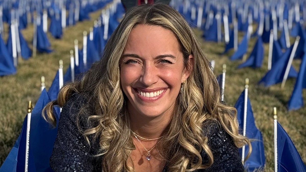 marisa peters in field of blue flags