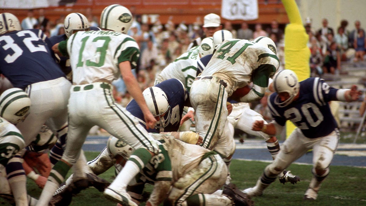 Matt Snell rushes with the football