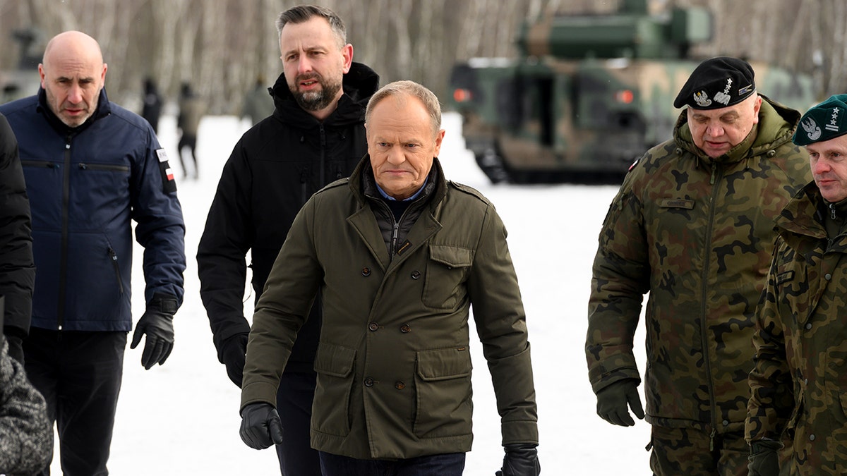 Polish Prime Minister Donald Tusk watches weapons test