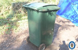 Woman & 2 men arrested over man found dead in wheelie bin after ‘hit-and-run’