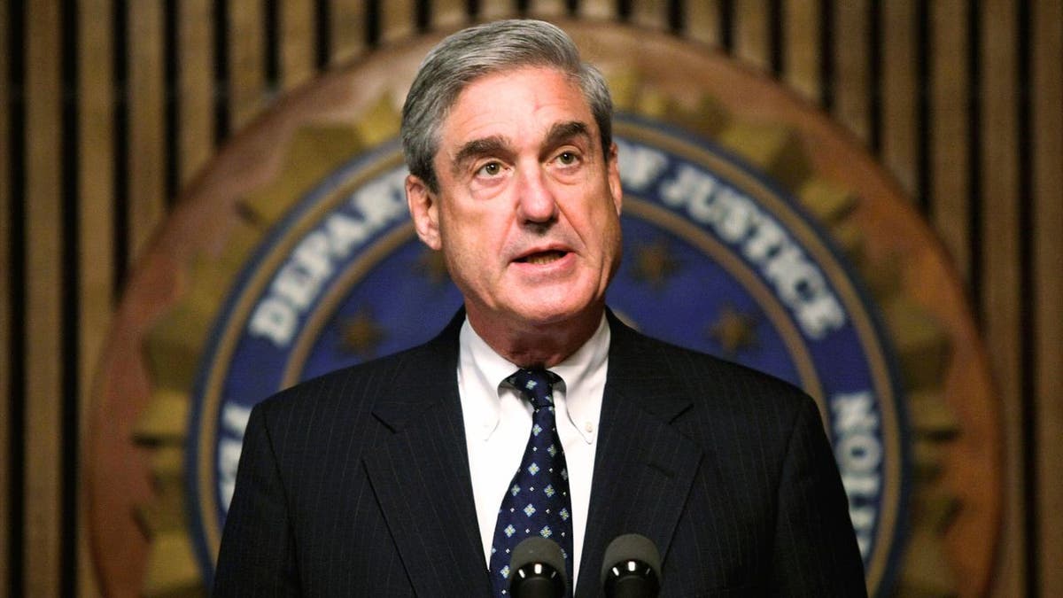 Robert Mueller speaking at FBI headquarters press conference in Washington, D.C.