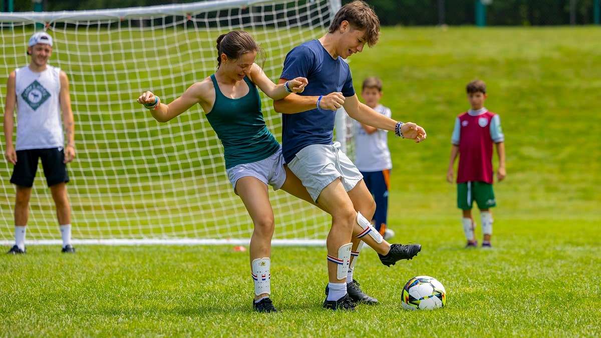Uribe siblings playing soccer